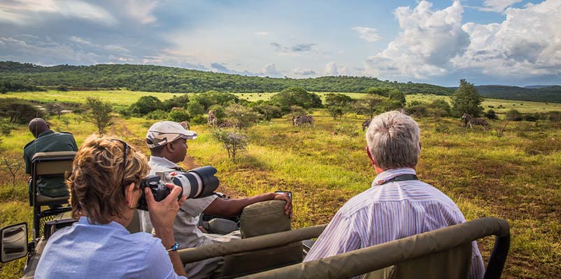 Senior travelers enjoying a comfortable private Tanzania safari vehicle in Serengeti